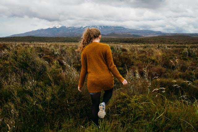 girl walking in field