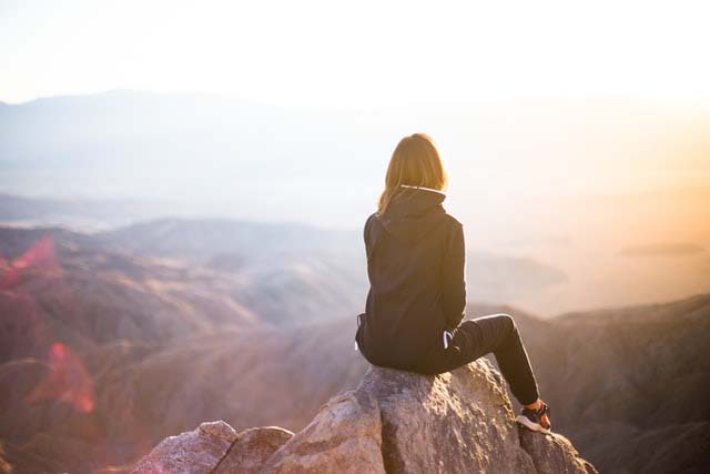 woman overlooking mountains